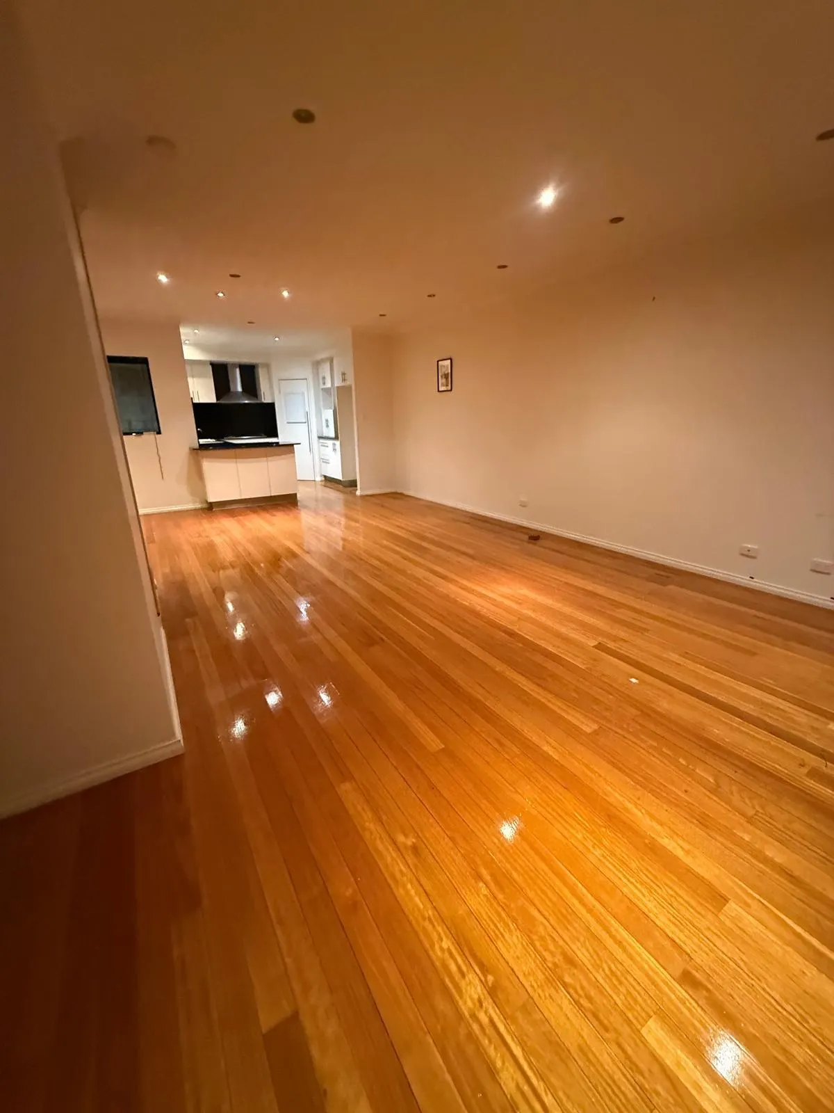 Timber floors in an empty living area - end of lease clean by Freshco Kleen in Perth